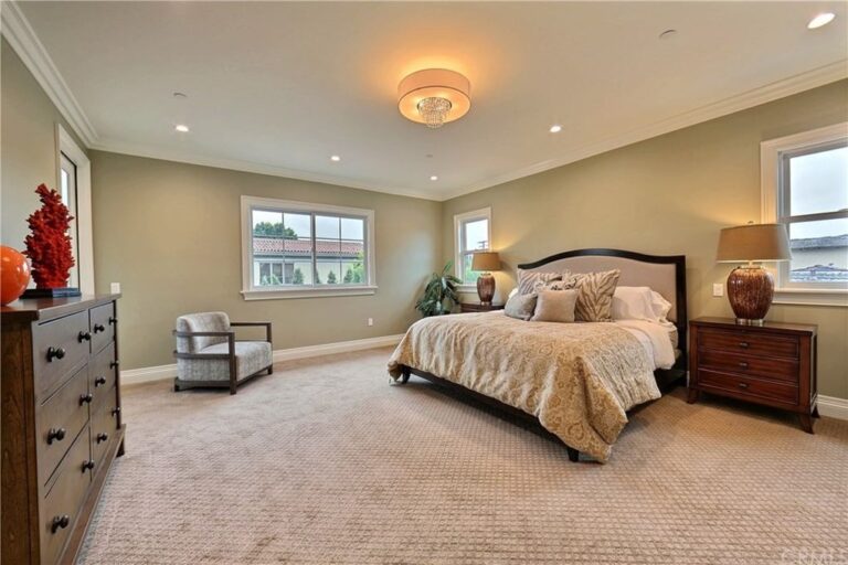 home bedroom with beige decor and a small window