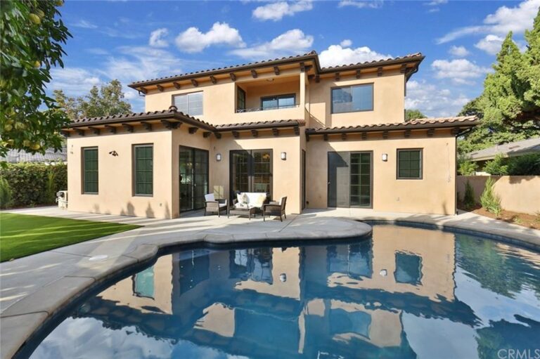 outside poolside view of a two story house